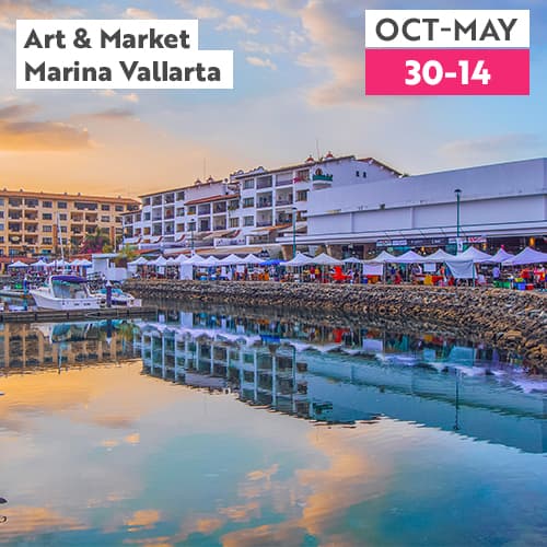 Marina Vallarta at sunset with the Art & Market white tents along the boardwalk